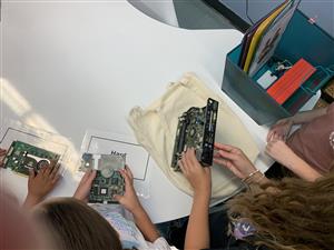 Students exploring the parts of the motherboard