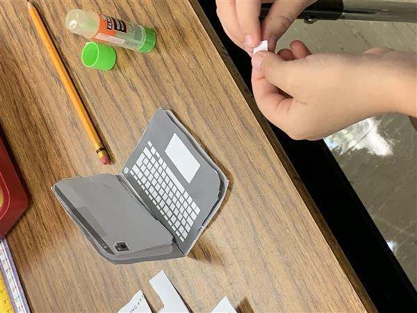 Putting the parts of the Chromebook together.